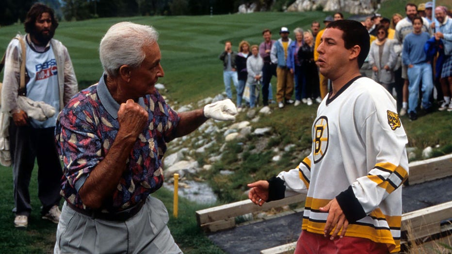 Bob Barker prepares to punch Adam Sandler in a scene from the film Happy Gilmore, 1996. (Photo by Universal/Getty Images)