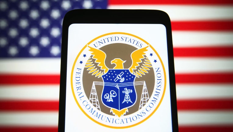 net neutrality: fcc logo on phone