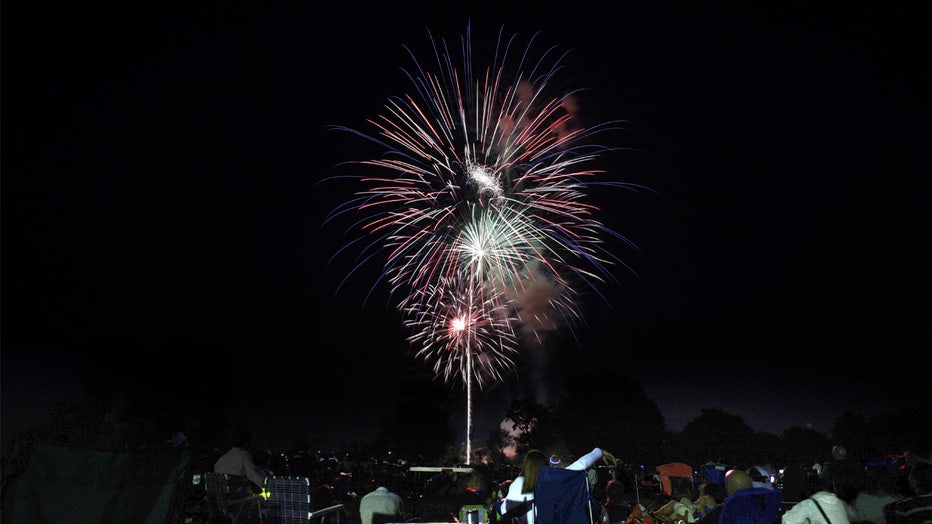 Spectators watch the 35th Annual Family Fourth of July Fireworks Celebration at Waveny Park, New Canaan, Connecticut, USA. 4th July 2015. Photo Tim Clayton (Photo by Tim Clayton/Corbis via Getty Images)