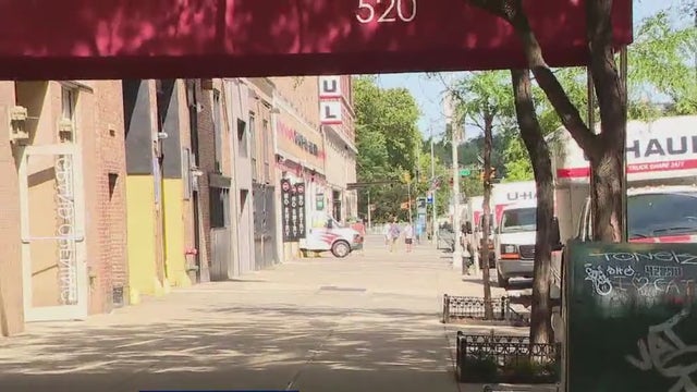 Woman charged with leaving naked newborn baby with umbilical cord outside NYC apartment