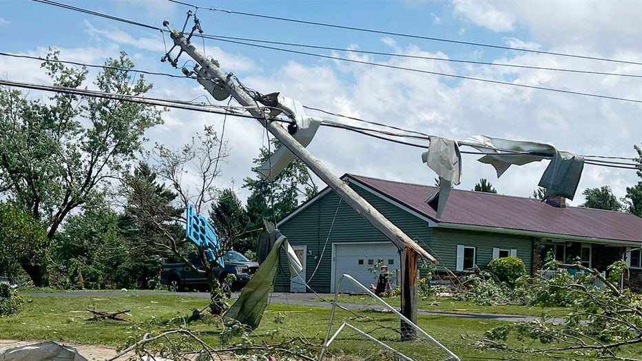 This image provided by the New York State Police, shows severe weather damage to a home and power lines in Eden, N.Y., Wednesday, July 10, 2024. (New York State Police via AP)