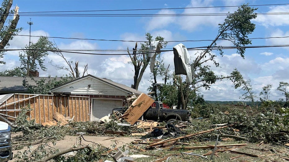 This photo provided by the New York State Police, shows severe weather damage to a home and power lines in Eden, N.Y., Wednesday, July 10, 2024. (New York State Police via AP)