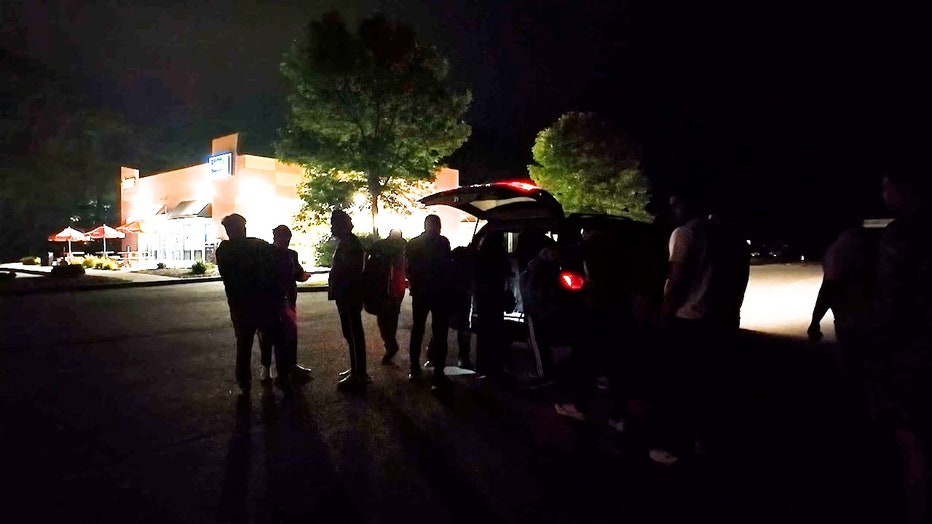 Migrants find a meeting point at a Plattsburgh, New York, gas station, 30 miles from the U.S.-Canada border.