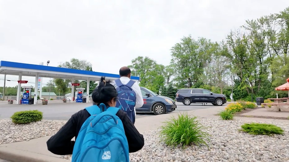 People who crossed the U.S.-Canada border walk through Clinton County, New York.