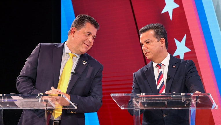 Candidates for the 1st Congressional District. Nick Lalota (left) and John Avlon briefly chat before participating in a televised debate at the NewsdayTV studio in Melville, New York, on October 18, 2024. Newsday columnist Joye Brown served as moderator. (Photo by John Paraskevas/Newsday RM via Getty Images)