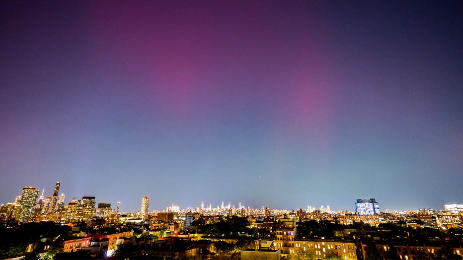 NEW YORK, NEW YORK – OCTOBER 11: The Northern Lights or Aurora Borealis are visible over the New York skyline on October 11, 2024 in New York City. (Photo by Roy Rochlin/Getty Images)