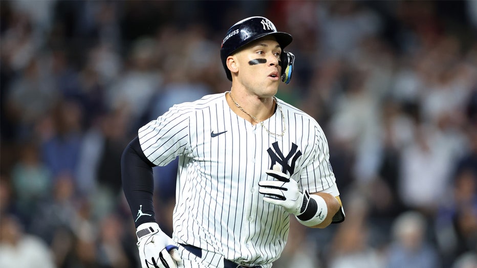 NEW YORK, NEW YORK - OCTOBER 07: Aaron Judge #99 of the New York Yankees reacts after flying out in the third inning against the Kansas City Royals during Game Two of the Division Series at Yankee Stadium on October 07, 2024 in New York City. (Photo by Luke Hales/Getty Images)