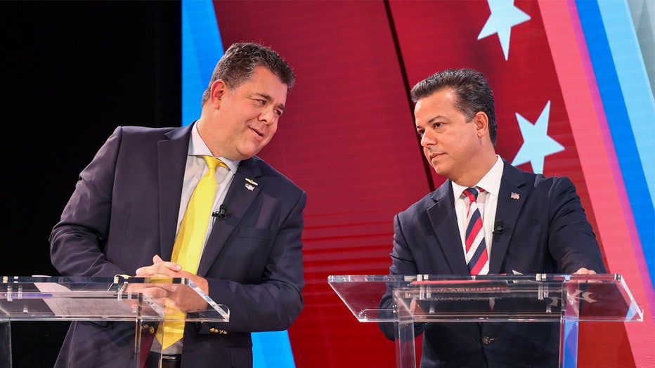 Melville, N.Y.: First Congressional District candidates. Nick Lalota, left, and John Avlon have a brief chat before taking part in a televised debate at the NewsdayTV studio in Melville, New York on Oct. 18, 2024. Newsday columnist Joye Brown served as moderator. (Photo by John Paraskevas/Newsday RM via Getty Images)