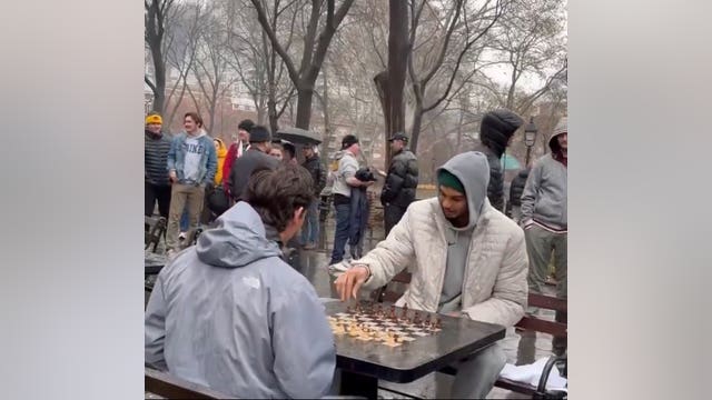 Victor Wembanyama plays chess in the rain at Washington Square Park