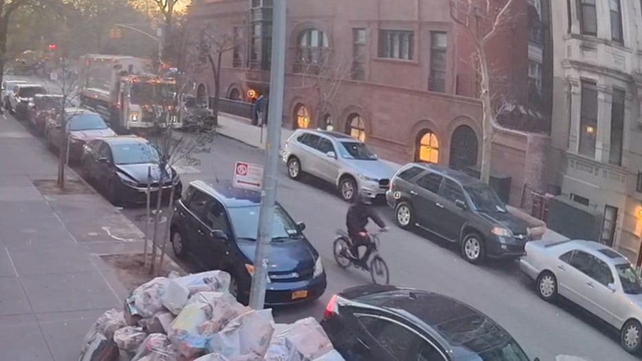 Video of the suspect in the CEO ambush shooting riding a bike down 85th Street near Central Park