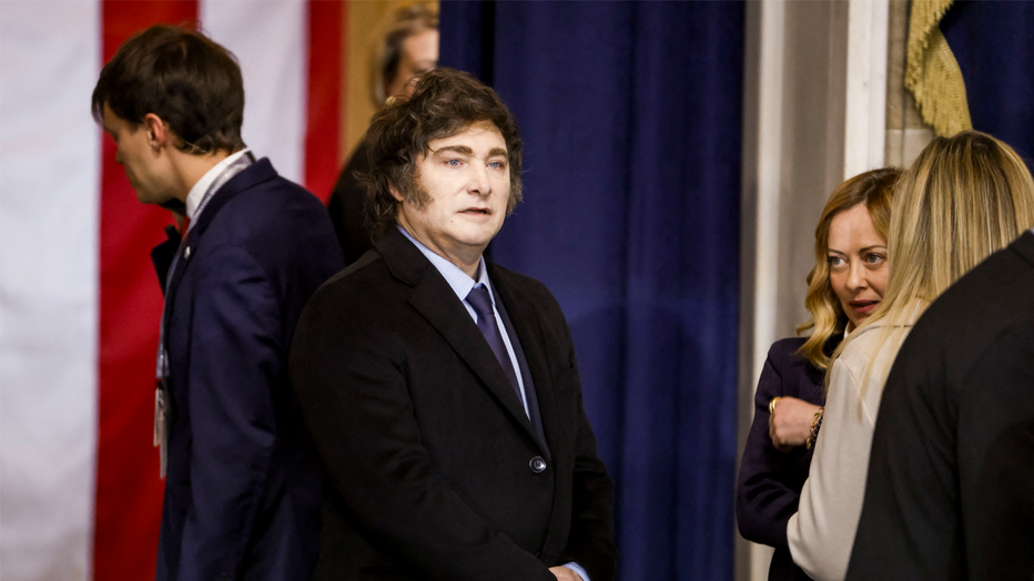 Argentina's President Javier Milei (C) and Prime Minister of Italy Giorgia Meloni (R) attend the inauguration ceremony of US President-elect Donald Trump in the US Capitol Rotunda in Washington, DC, on January 20, 2025. (Photo by Shawn THEW / POOL / AFP) (Photo by SHAWN THEW/POOL/AFP via Getty Images)