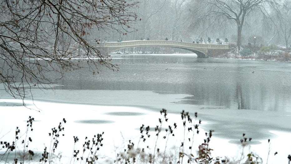 The Bow Bridge in the snow in Central Park January 6, 2025 in New York City as a major winter storm hits the Mid-Atlantic region. A massive storm system dumped heavy snow and freezing rain on large swaths of the eastern United States Monday, disrupting travel and work for millions of Americans from the Ohio Valley to the capital Washington. (Photo by TIMOTHY A. CLARY / AFP) (Photo by TIMOTHY A. CLARY/AFP via Getty Images)
