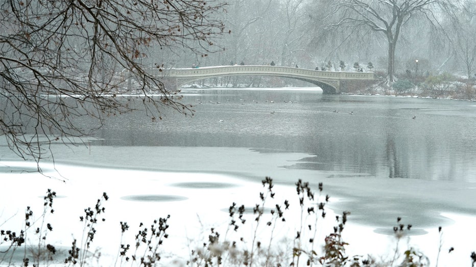 The Bow Bridge in the snow in Central Park January 6, 2025 in New York City as a major winter storm hits the Mid-Atlantic region. A massive storm system dumped heavy snow and freezing rain on large swaths of the eastern United States Monday, disrupting travel and work for millions of Americans from the Ohio Valley to the capital Washington. (Photo by TIMOTHY A. CLARY / AFP) (Photo by TIMOTHY A. CLARY/AFP via Getty Images)