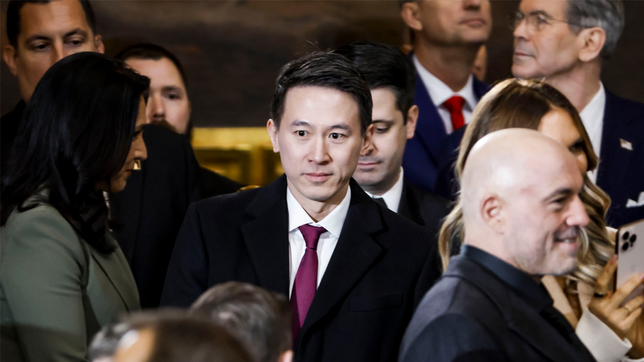 Shou Zi Chew, chief executive officer of TikTok Inc., center, arrives for the 60th presidential inauguration in the rotunda of the US Capitol in Washington, DC, US, on Monday, Jan. 20, 2025. Donald Trump's Monday swearing-in marks just the second time in US history that a president lost the office and managed to return to power - a comeback cementing his place within the Republican Party as an enduring, transformational figure rather than a one-term aberration. Photographer: Shawn Thew/EPA/Bloomberg via Getty Images
