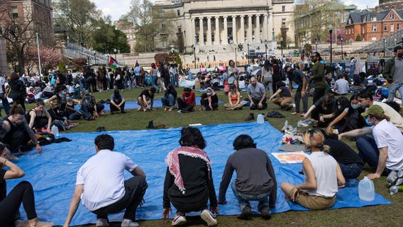Columbia University's interim president steps down and returns to former post