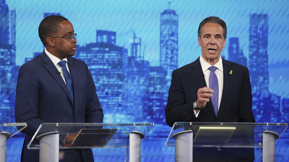 NEW YORK, NEW YORK - JUNE 4: Andrew Cuomo, center, speaks as Zellnor Myrie, left, looks on, in the New York City Democratic Mayoral Primary Debate at NBC Studios on June 4, 2025 in New York City. Nine candidates are taking the stage for the first debate of the primary election for mayor. (Photo by Yuki Iwamura-Pool/Getty Images)