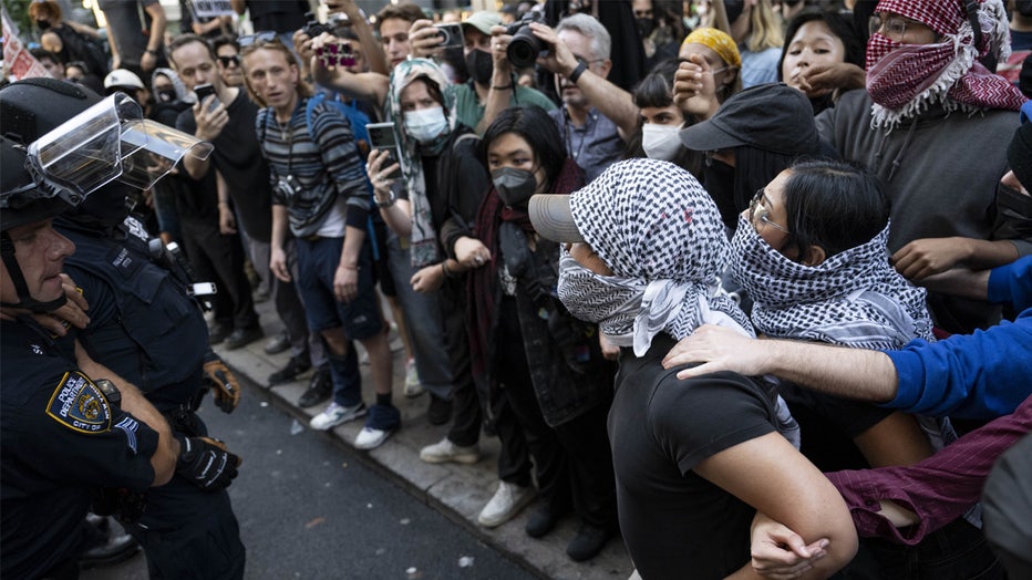 NEW YORK, UNITED STATES - JUNE 10: Protestors confront NYPD officers during an anti-ICE protest outside 26 Federal Plaza Building in New York City, New York, U.S., June 10, 2025. (Photo by Mostafa Bassim/Anadolu via Getty Images)