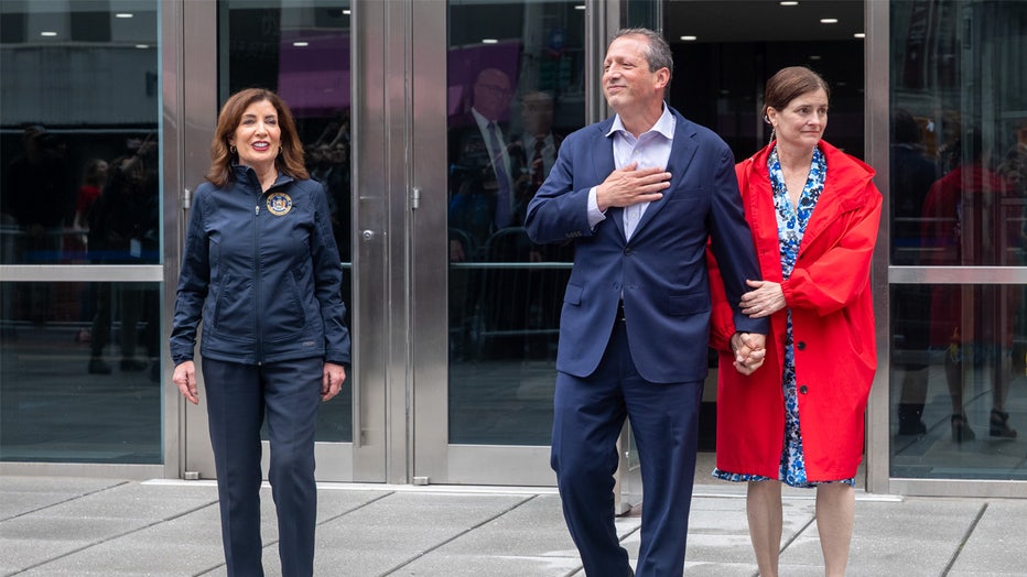 NEW YORK, NEW YORK - JUNE 17: New York City Comptroller and mayoral candidate Brad Lander walks out of a federal building with his wife Meg Barnette and New York Governor Kathy Hochul (L) after he was detained by Immigration and Customs Enforcement (ICE) agents on June 17, 2025 in New York City. Lander was arrested by masked federal agents while visiting an immigration court and accompanying a person out of a courtroom. He was held for over three hours before being released without charges. (Photo by Spencer Platt/Getty Images)
