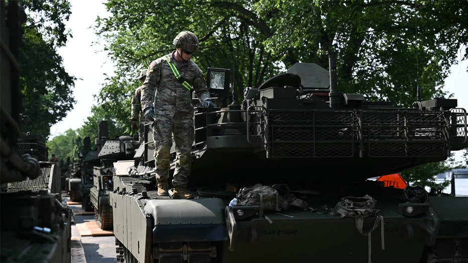 A US soldier is seen on top of a Bradley tank during a media preview of the Army's Parade at West Potomac Park in Washington, DC on June 11, 2025. A military parade and celebration of the 250th birthday of the US Army will be held in Washington, DC, on June 14, which also coincides with President Donald Trump's 78th birthday. (Photo by Mandel NGAN / AFP) (Photo by MANDEL NGAN/AFP via Getty Images)