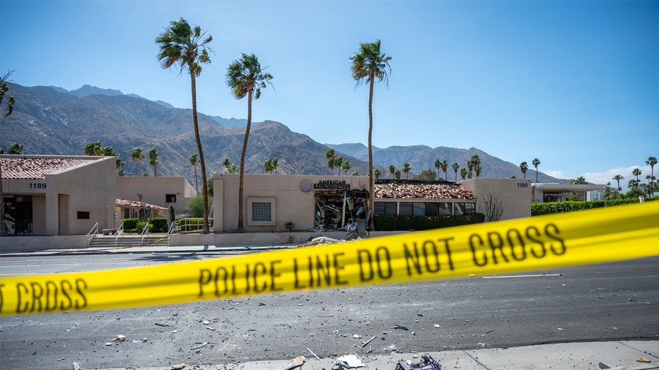 TOPSHOT - A police line is seen outside a damaged American Reproductive Centers fertility clinic after a bomb blast outside the building in Palm Springs, California, on May 17, 2025. A bomb blast outside a California fertility clinic killed one person Saturday, in what the US attorney general called an "unforgivable" attack. The blast ripped through downtown Palm Springs, badly damaging the clinic and blowing out the windows and doors of other nearby buildings. (Photo by Gabriel Osorio / AFP) (Photo by GABRIEL OSORIO/AFP via Getty Images)