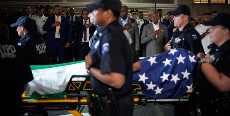 Slain NYPD officer hailed as hero as flags fly half-staff to honor NYC shooting victims