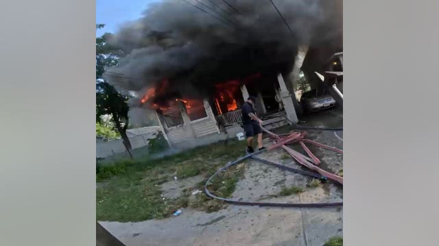 Child trapped in house fire jumps into arms of NJ officer