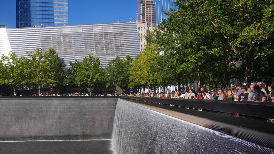 NEW YORK, UNITED STATES - SEPTEMBER 11: People take part in the commemoration ceremony on the 23rd anniversary of the September 11 terror attack on the World Trade Center around South Tower Memorial Pool in New York City, United States on September 11, 2024. Despite the presence of top political figures such as US President Joe Biden, Vice President and Democratic presidential candidate Kamala Harris and Republican presidential candidate Donald Trump, Americans did not show as much interest as in previous years. Firefighters and Christian missionary groups, who were among the groups that lost the most lives in the attacks in New York, also participated heavily in the ceremonies this year. (Photo by Selcuk Acar/Anadolu via Getty Images)
