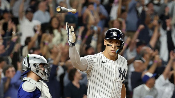 Judge rallies Yankees past Blue Jays 9-6 to save season and avert ALDS sweep