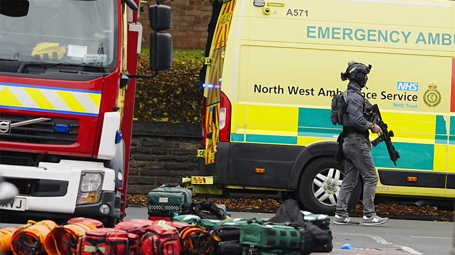 An armed officer at the scene of an incident at Heaton Park Hebrew Congregation synagogue in Crumpsall, Manchester, where police have shot a suspect after several people were stabbed and a car was driven at members of the public. Picture date: Thursday October 2, 2025. (Photo by Peter Byrne/PA Images via Getty Images)
