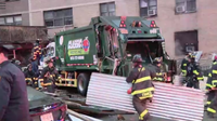 Woman killed in East Harlem garbage truck crash after scaffolding collapses
