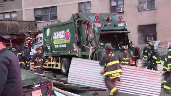 Woman killed in East Harlem garbage truck crash after scaffolding collapses