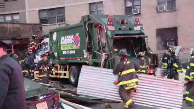 Woman killed in East Harlem garbage truck crash after scaffolding collapses
