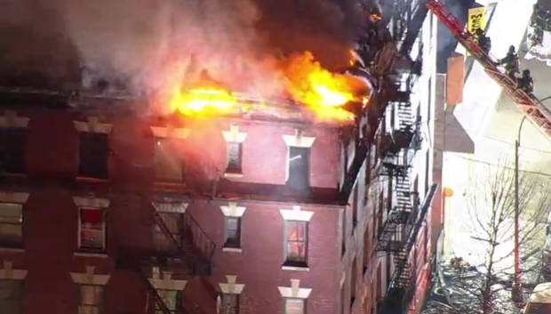 Flames rip through roof of Bronx building in five-alarm fire: 1 dead, 4 injured