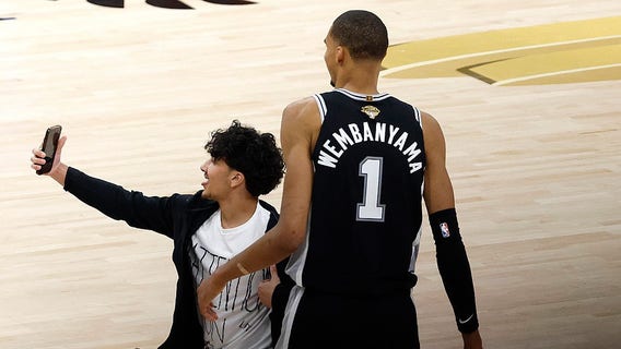 NBA bans 2 fans for life after man rushes court during Finals Game 1