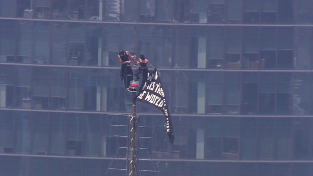 Empire State Building climb: 2 in custody after raising flag, proposing at top of spire