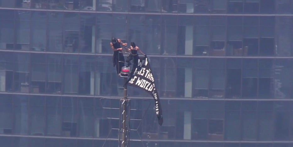 Empire State Building climb: 2 in custody after raising flag, proposing at top of spire