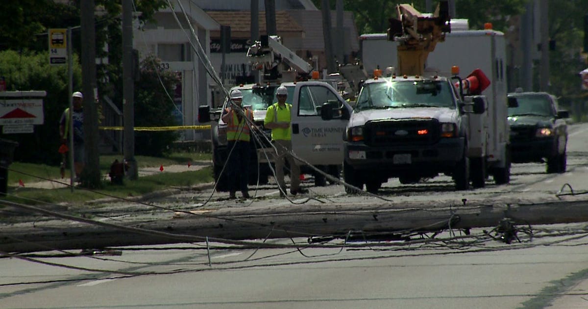 Dump truck with raised box strikes power lines, takes out power poles ...