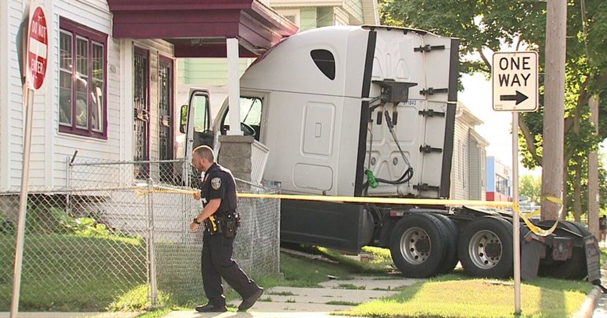 Semi driver arrested for OWI after crashing into home while attempting ...