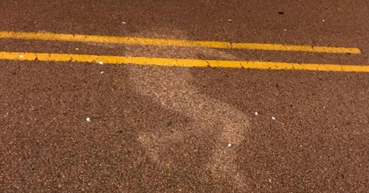 Outline of person who laid in rainy street prompts PSA from police: 'Not a safe place for a nap!'