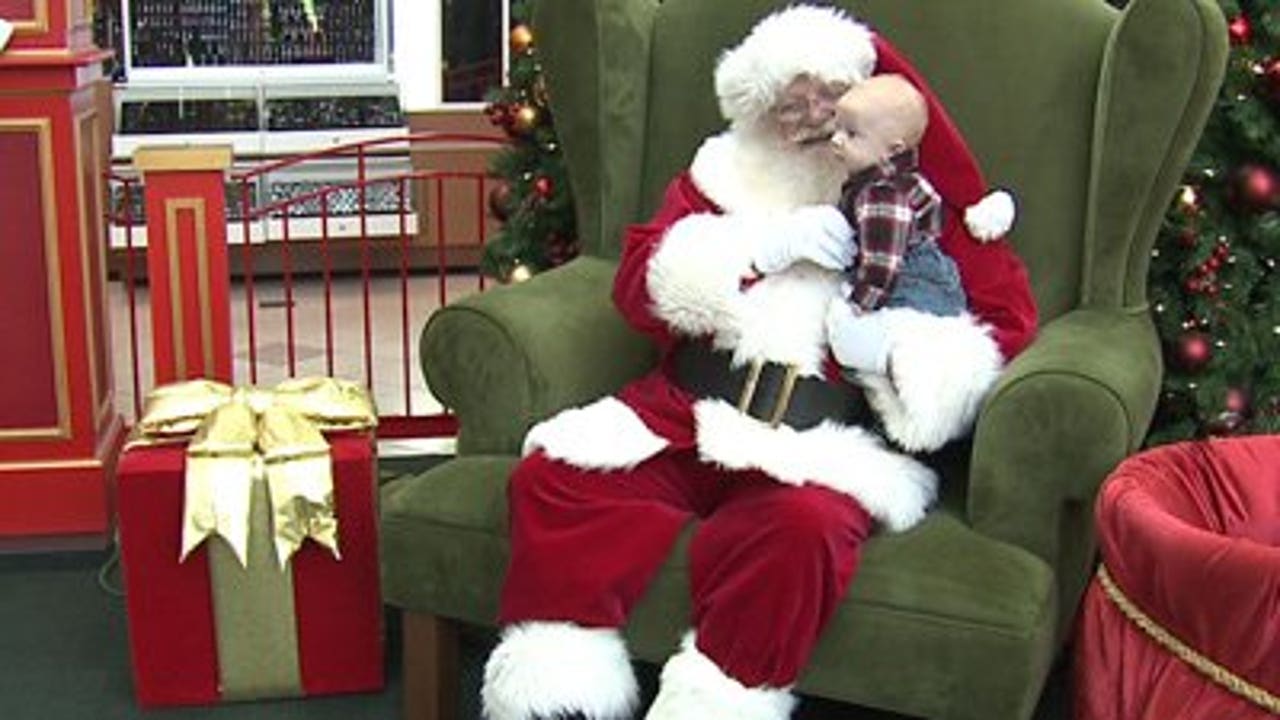 Santa Claus now visiting with children at Mayfair Mall