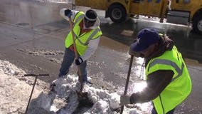 Milwaukee crews work to free sewer grates of slush and ice