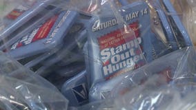 Letter carriers work overtime on their day off, gearing up for "Stamp Out Hunger" food drive