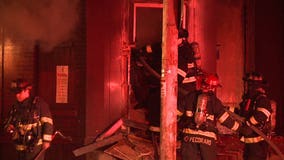 'Absolutely packed' with junk: Firefighters battle vacant building fire near 12th and Juneau