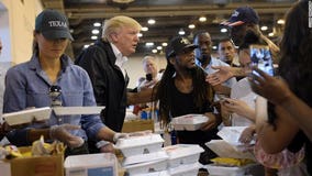 Upbeat President Trump pitches in at shelter for Harvey victims