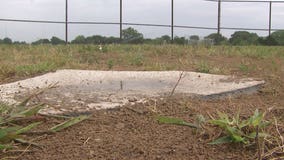 Police, firefighters join effort to build new baseball field at Racine school: "We can't repair it"