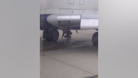 Airplane experiences "hard landing" after tire blows at airport