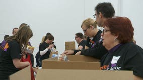 "We need to get the food out:" Hundreds of volunteers pack pallets of food for Hunger Task Force