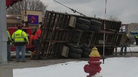 Tractor trailer carrying piece of machinery rolled over near Port Washington Rd., Silver Spring Dr.