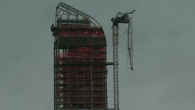 Crane partially collapses, dangles over New York street