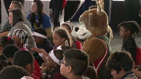 Milwaukee Bucks players, coaches and Bango encourage children to read